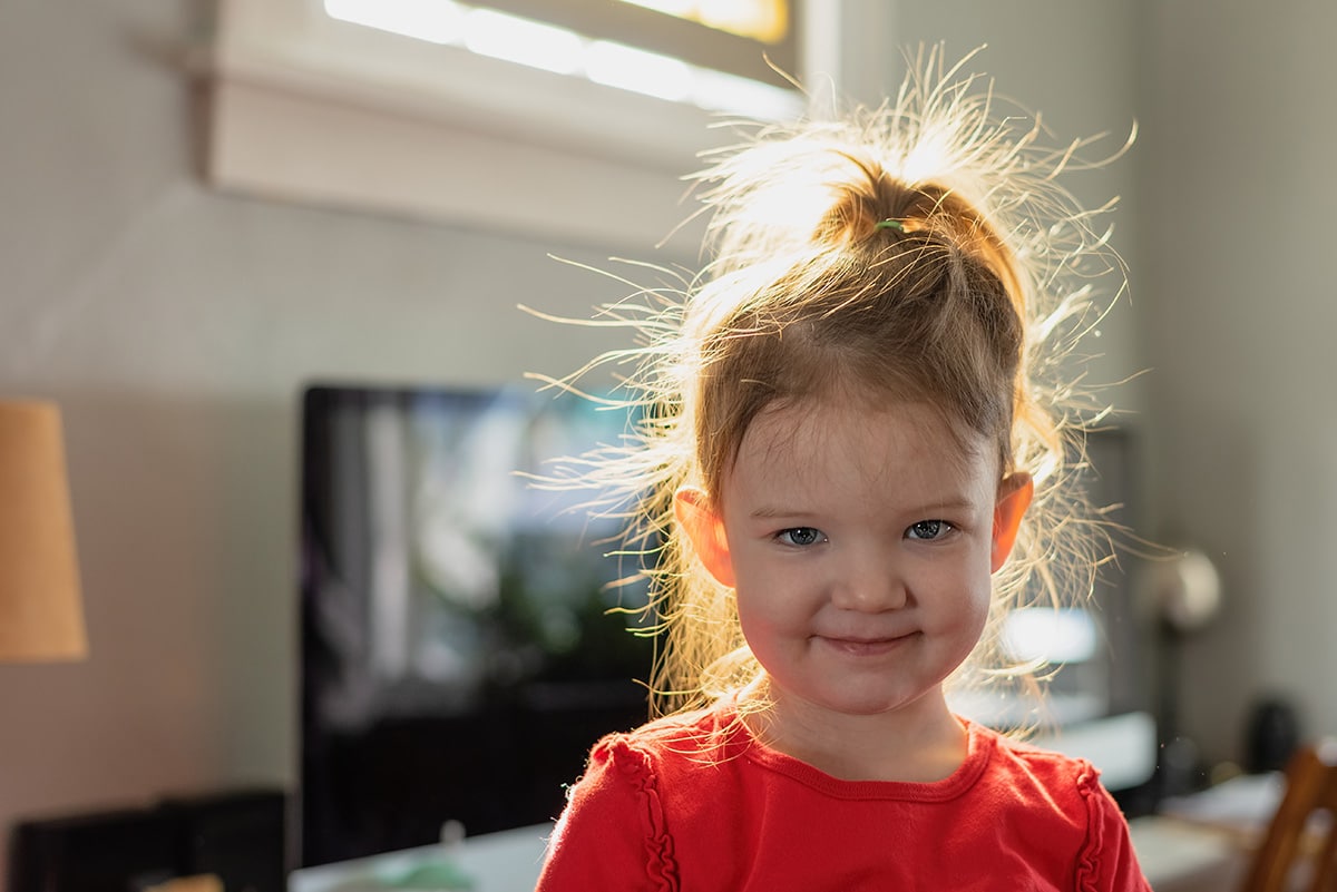 child with static build up in hair