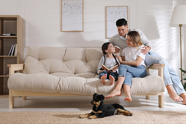 happy family with dog on couch