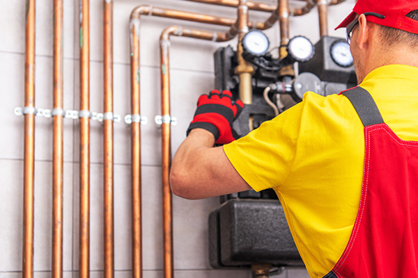 Man working on commercial heater repair